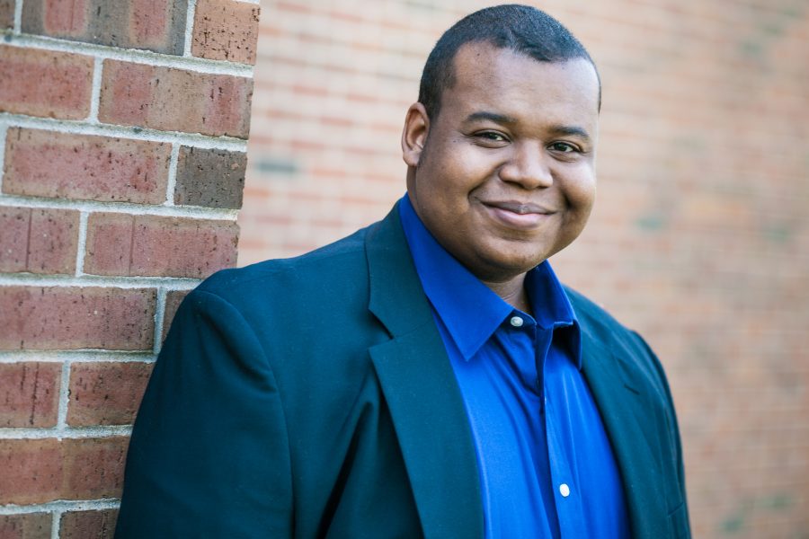 Evan Williams standing near a wall