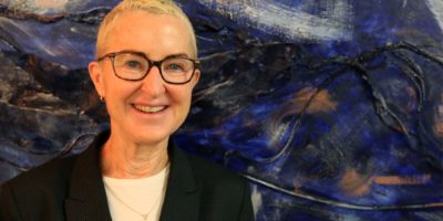 Myra Melford in front of the New Music USA mural. 