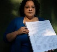 A woman posing with her score