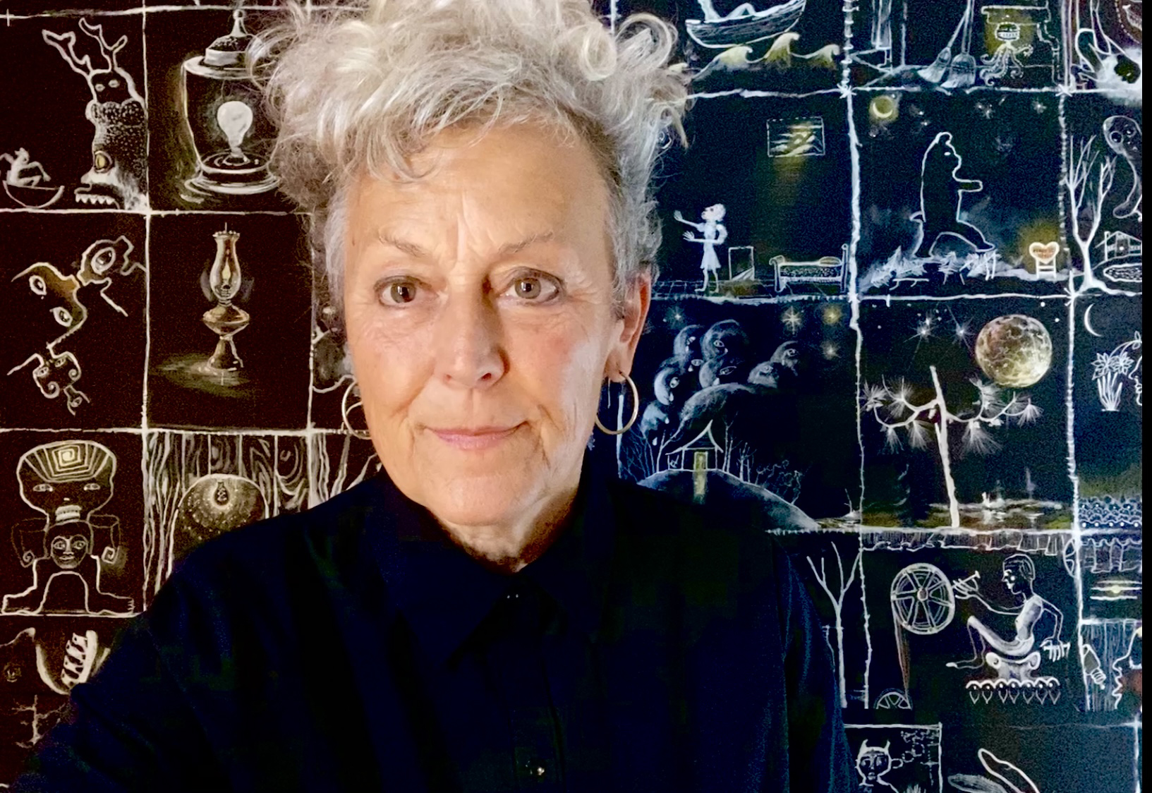 Liz Downing in front of one of her paintings.