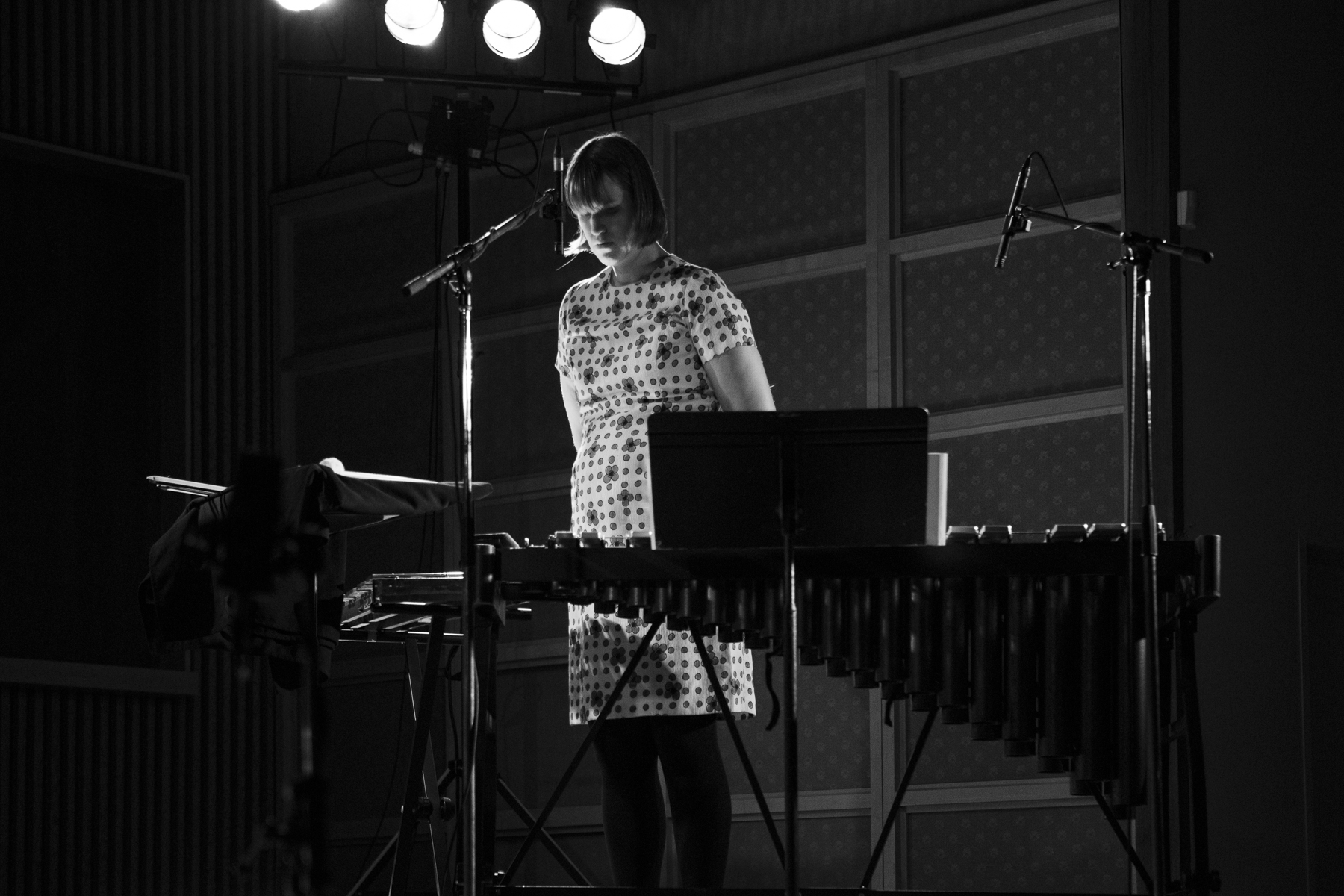 Sarah Hennies in performance playing two mallet percussion instruments (Photo by Claire Harvie)